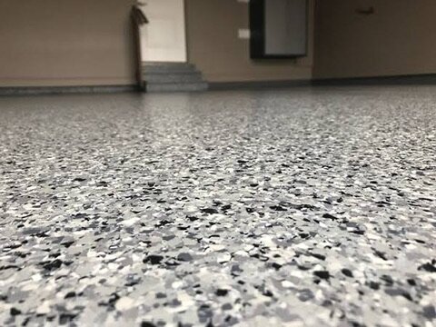Close-up of grey and black flake epoxy floor texture — Epox It Flooring
