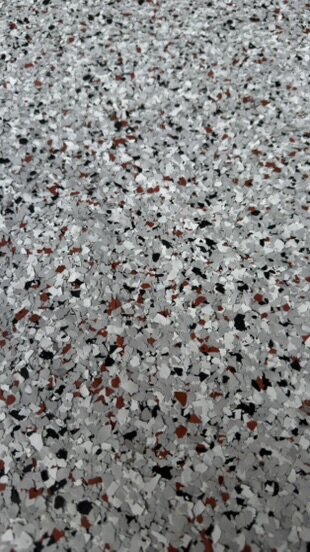 Macro detail of full-broadcast flake epoxy floor — Epox It Flooring