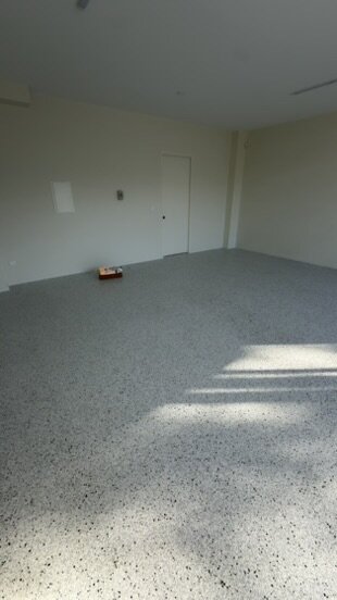 Light flake epoxy floor in a residential garage — Epox It Flooring