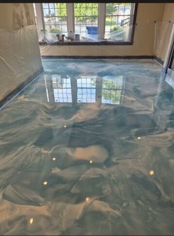 Ocean blue metallic epoxy floor in a living area — Epox It Flooring