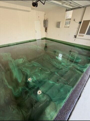 Emerald green metallic epoxy floor with swirl effect — Epox It Flooring